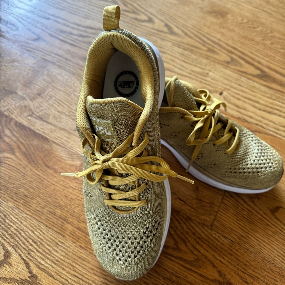 APL gold sneakers